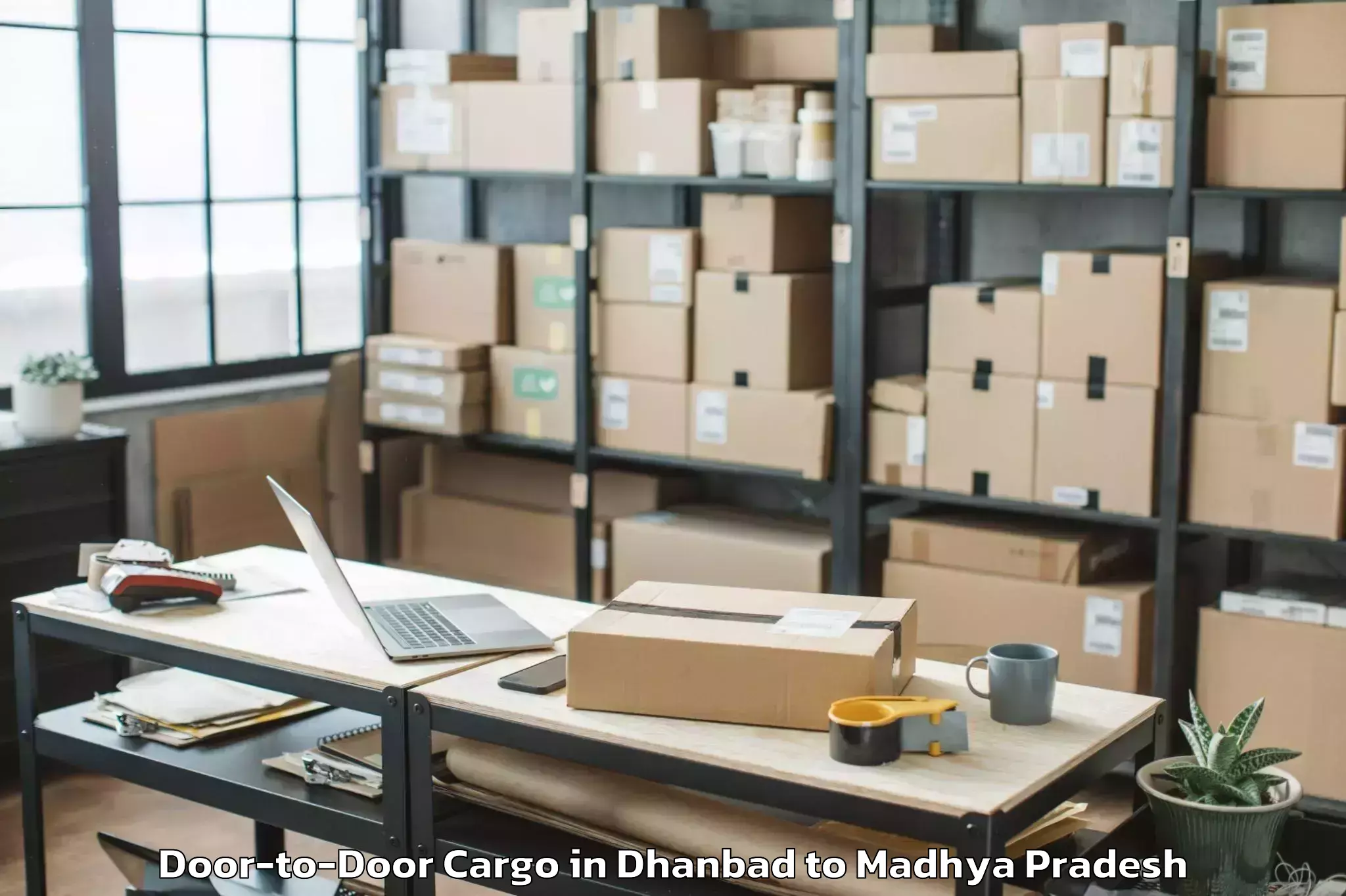 Leading Dhanbad to Pdpm Indian Institute Of Infor Door To Door Cargo Provider